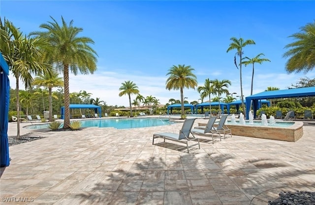 11704 Stonecreek Cir, Fort Myers, FL 33913 - community pool with a patio