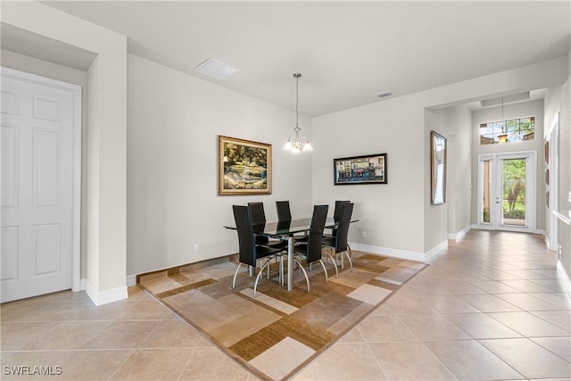 11704 Stonecreek Cir, Fort Myers, FL 33913 - dining room with light tile patterned floors, a chandelier, and baseboards
