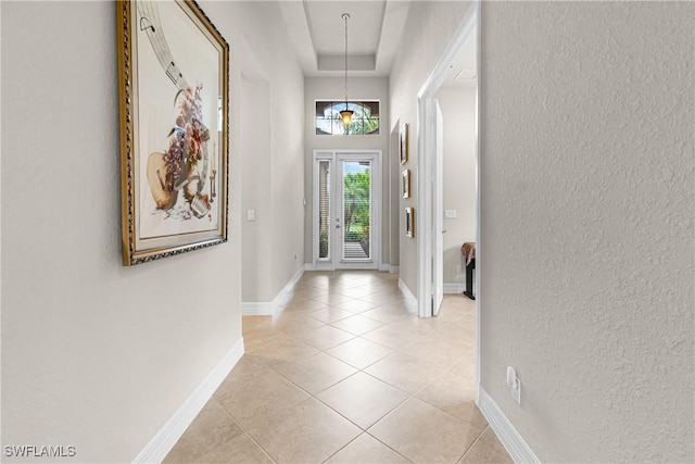 11704 Stonecreek Cir, Fort Myers, FL 33913 - entrance foyer featuring a textured wall, light tile patterned flooring, and baseboards