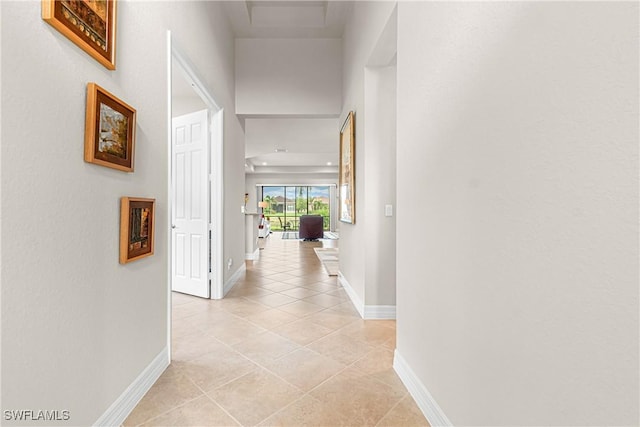 11704 Stonecreek Cir, Fort Myers, FL 33913 - corridor featuring baseboards and light tile patterned flooring