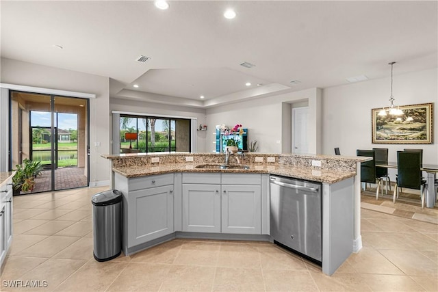 11704 Stonecreek Cir, Fort Myers, FL 33913 - kitchen featuring stainless steel dishwasher, a sink, light stone counters, recessed lighting, and light tile patterned flooring
