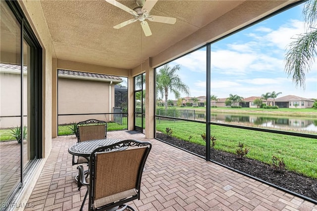 11704 Stonecreek Cir, Fort Myers, FL 33913 - sunroom / solarium with a water view, a ceiling fan, and a residential view