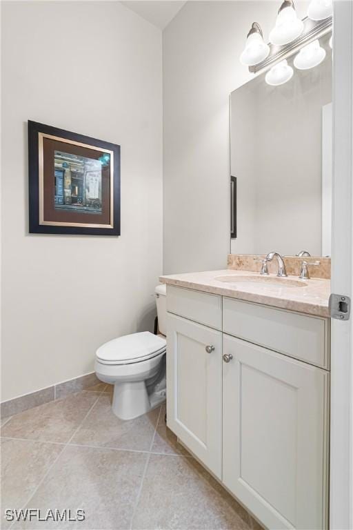 11704 Stonecreek Cir, Fort Myers, FL 33913 - bathroom with vanity, toilet, a chandelier, tile patterned flooring, and baseboards