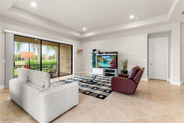 11704 Stonecreek Cir, Fort Myers, FL 33913 - living area with a raised ceiling, light tile patterned flooring, baseboards, and recessed lighting