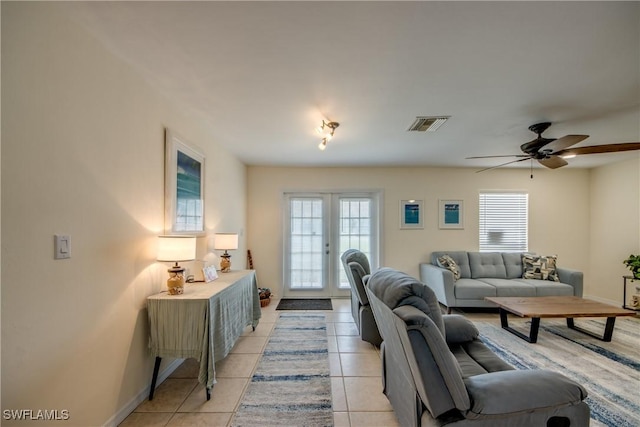 4149 Shellcrest Rd, Saint James City, FL 33956 - living area featuring healthy amount of natural light, light tile patterned floors, ceiling fan, and baseboards