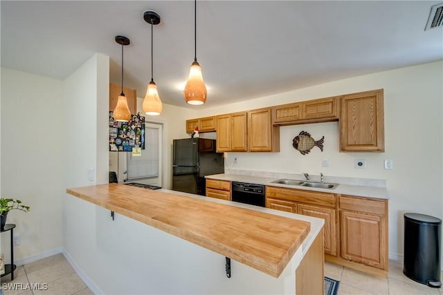 4149 Shellcrest Rd, Saint James City, FL 33956 - kitchen featuring black appliances, a sink, a peninsula, light tile patterned floors, and baseboards