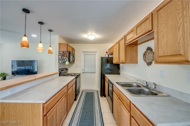 4149 Shellcrest Rd, Saint James City, FL 33956 - kitchen with black appliances, a sink, light countertops, and decorative light fixtures