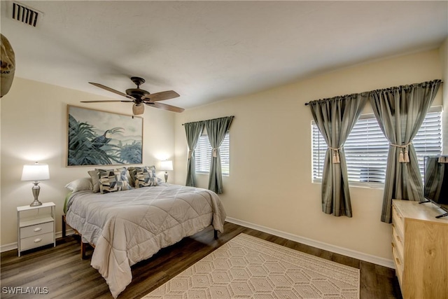 4149 Shellcrest Rd, Saint James City, FL 33956 - bedroom with baseboards, wood finished floors, and a ceiling fan