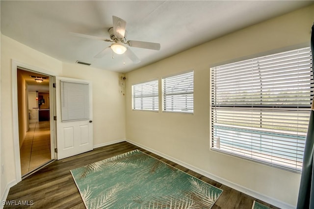 4149 Shellcrest Rd, Saint James City, FL 33956 - unfurnished room with ceiling fan, dark wood-type flooring, and baseboards