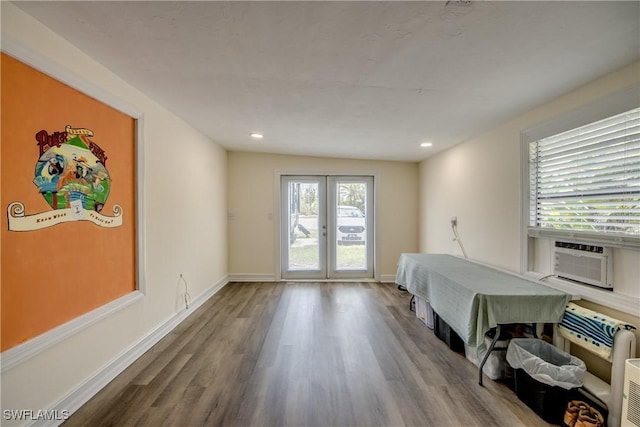 4149 Shellcrest Rd, Saint James City, FL 33956 - bedroom with wood finished floors, access to exterior, cooling unit, baseboards, and recessed lighting