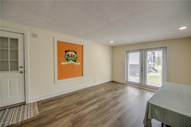 4149 Shellcrest Rd, Saint James City, FL 33956 - unfurnished dining area featuring wood finished floors, recessed lighting, and baseboards