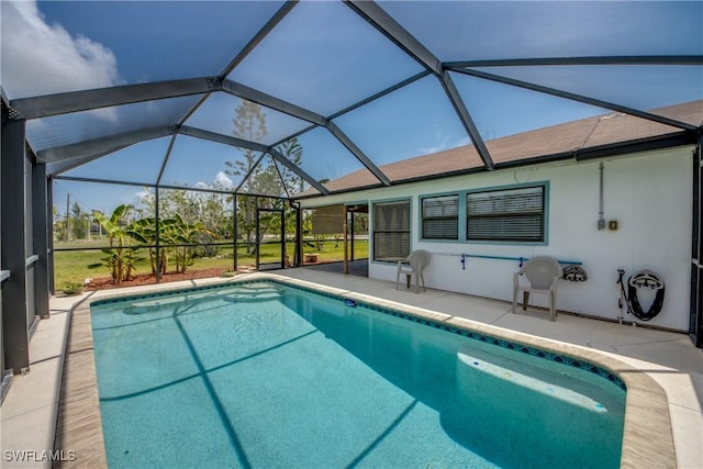 4149 Shellcrest Rd, Saint James City, FL 33956 - swimming pool featuring a patio area and glass enclosure