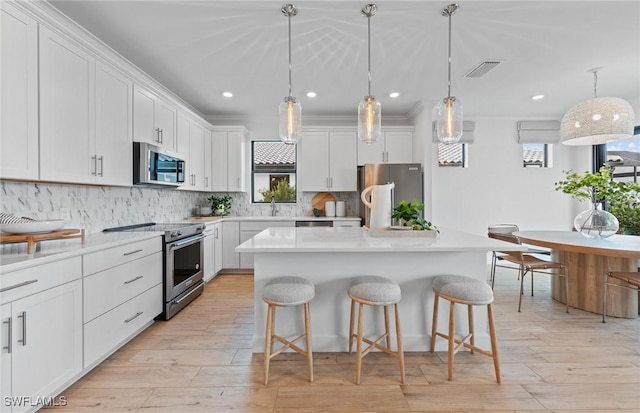 7049 Chapel Creek Ln, North Fort Myers, FL 33917 - kitchen featuring stainless steel appliances, healthy amount of natural light, backsplash, and recessed lighting