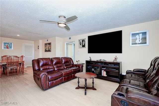 1100 8th Ave S Unit 309C, Naples, FL 34102 - living room featuring ceiling fan, light wood-style floors, a textured ceiling, and recessed lighting