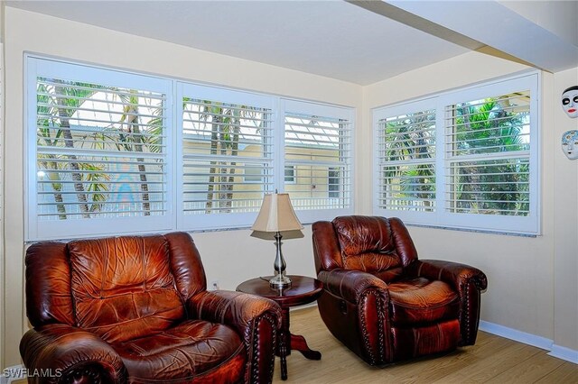 1100 8th Ave S Unit 309C, Naples, FL 34102 - sitting room featuring wood finished floors, plenty of natural light, and baseboards