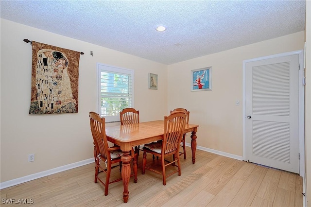 1100 8th Ave S Unit 309C, Naples, FL 34102 - dining space featuring light wood-style floors, recessed lighting, baseboards, and a textured ceiling