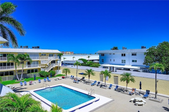 1100 8th Ave S Unit 309C, Naples, FL 34102 - community pool featuring a patio area