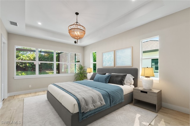 14302 Charthouse Cir, Naples, FL 34114 - bedroom featuring a tray ceiling, baseboards, multiple windows, and recessed lighting