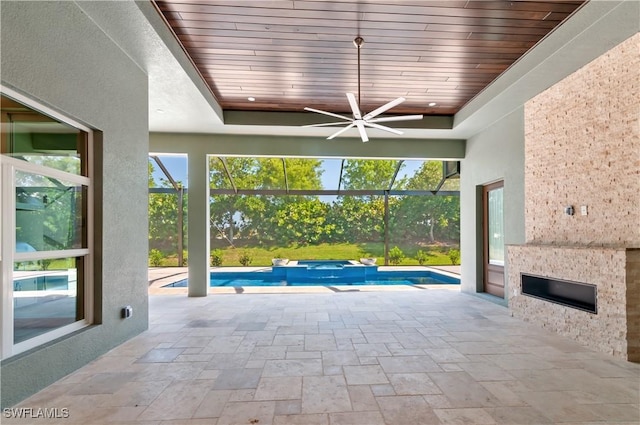 14302 Charthouse Cir, Naples, FL 34114 - view of patio / terrace with ceiling fan, a pool with connected hot tub, and glass enclosure