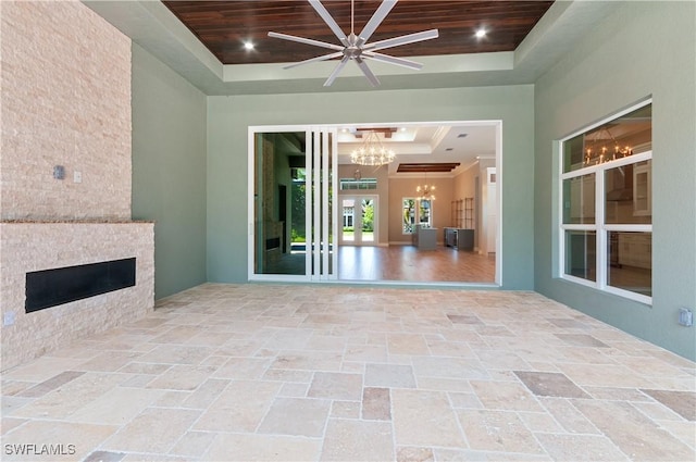 14302 Charthouse Cir, Naples, FL 34114 - view of patio / terrace featuring a fireplace and ceiling fan