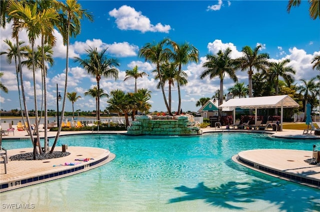 14302 Charthouse Cir, Naples, FL 34114 - community pool featuring a patio area