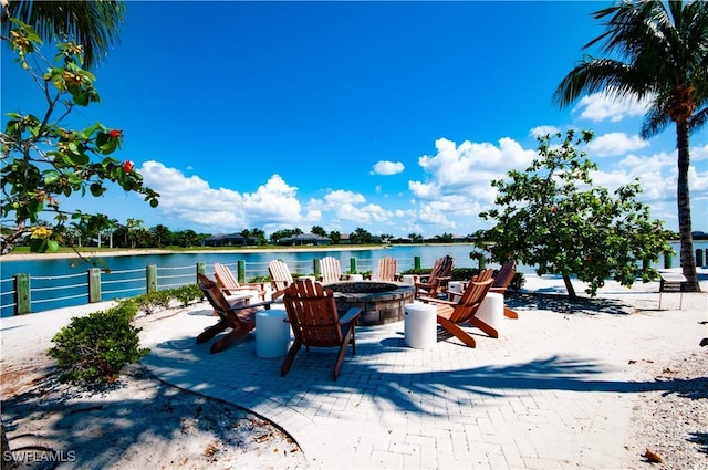 14302 Charthouse Cir, Naples, FL 34114 - view of patio featuring an outdoor fire pit and a water view