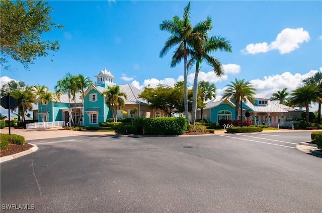 14302 Charthouse Cir, Naples, FL 34114 - view of asphalt street featuring curbs and traffic signs