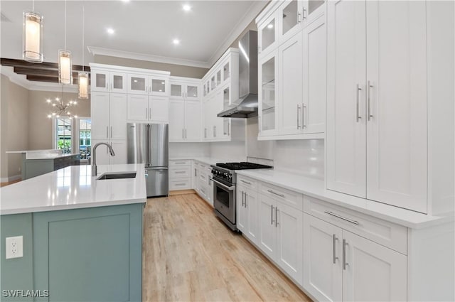 14302 Charthouse Cir, Naples, FL 34114 - kitchen with appliances with stainless steel finishes, a sink, ornamental molding, wall chimney exhaust hood, and an island with sink