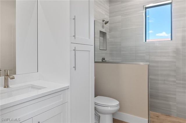 14302 Charthouse Cir, Naples, FL 34114 - bathroom with vanity, a walk in shower, and toilet