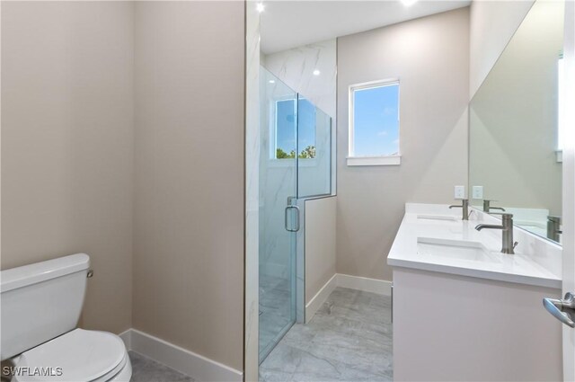 14302 Charthouse Cir, Naples, FL 34114 - full bath with toilet, double vanity, a shower stall, baseboards, and marble look tile flooring