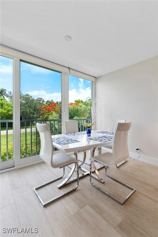 460 Broad Ave S Unit H460, Naples, FL 34102 - dining space with wood finished floors and baseboards