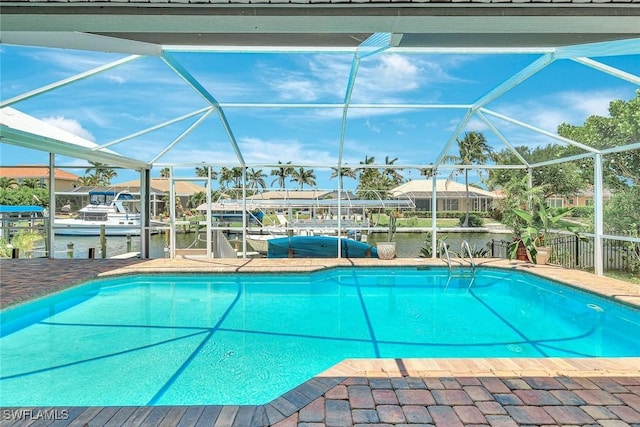 5012 SW 8th Pl, Cape Coral, FL 33914 - outdoor pool with a boat dock, boat lift, a water view, and a lanai