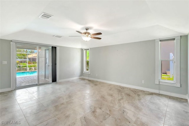 5012 SW 8th Pl, Cape Coral, FL 33914 - unfurnished room with a ceiling fan, healthy amount of natural light, baseboards, vaulted ceiling, and tile patterned flooring