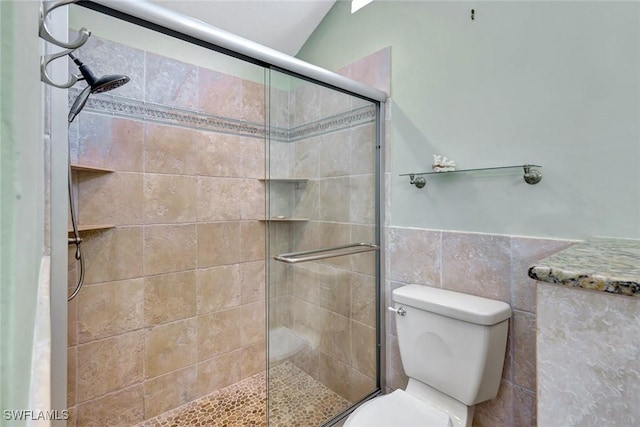 5012 SW 8th Pl, Cape Coral, FL 33914 - full bath with toilet, a tile shower, wainscoting, and tile walls