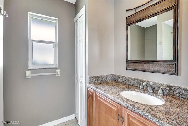 5012 SW 8th Pl, Cape Coral, FL 33914 - bathroom featuring vanity, tile patterned floors, and baseboards