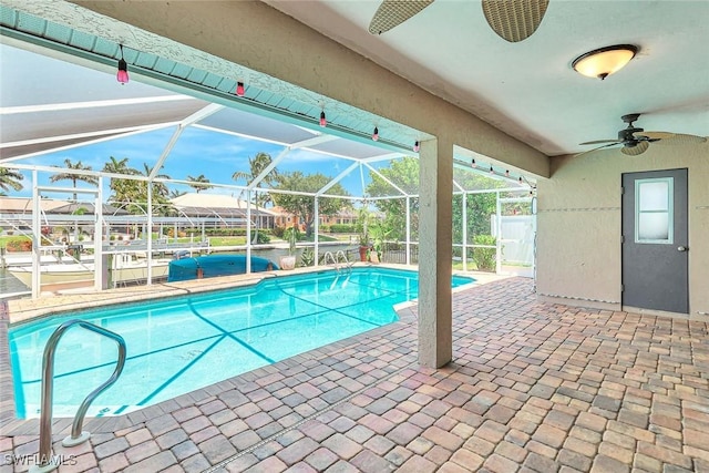 5012 SW 8th Pl, Cape Coral, FL 33914 - outdoor pool featuring a ceiling fan, a patio, and glass enclosure