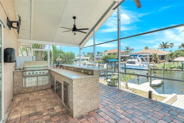 5012 SW 8th Pl, Cape Coral, FL 33914 - view of patio featuring a water view, a dock, and a ceiling fan