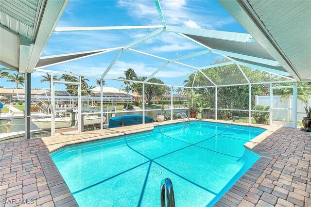 5012 SW 8th Pl, Cape Coral, FL 33914 - swimming pool featuring a hot tub, a patio area, and a lanai