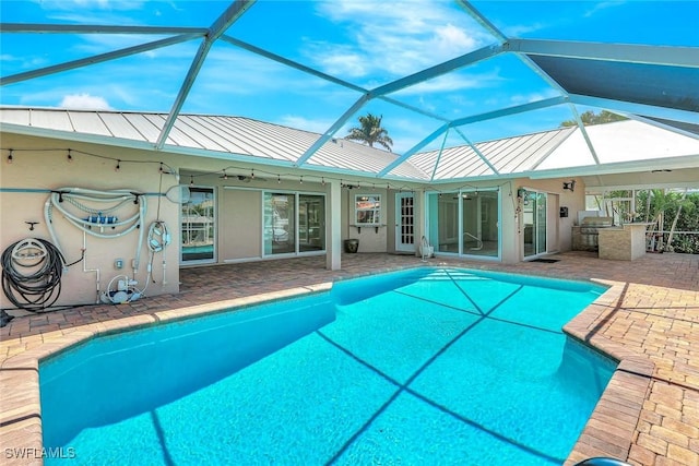 5012 SW 8th Pl, Cape Coral, FL 33914 - swimming pool featuring exterior kitchen, a patio, and a lanai