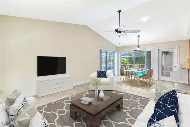5012 SW 8th Pl, Cape Coral, FL 33914 - living room featuring ceiling fan, vaulted ceiling, baseboards, and light tile patterned flooring
