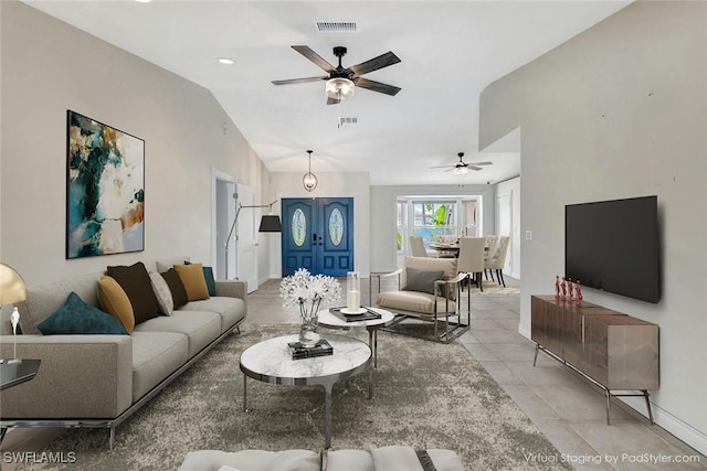 5012 SW 8th Pl, Cape Coral, FL 33914 - living area featuring ceiling fan, vaulted ceiling, light tile patterned floors, and baseboards