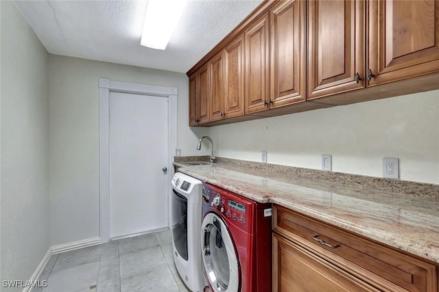 5012 SW 8th Pl, Cape Coral, FL 33914 - laundry room with cabinet space, independent washer and dryer, baseboards, and light tile patterned floors