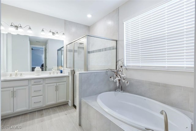 28086 Captiva Shell Loop, Bonita Springs, FL 34135 - bathroom with a garden tub, a shower stall, and double vanity