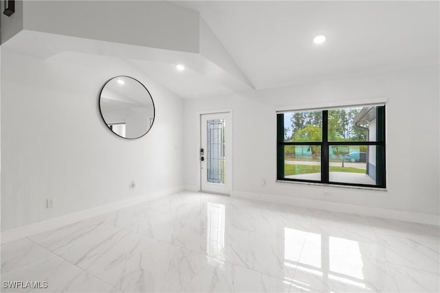 3613 39th St SW, Lehigh Acres, FL 33976 - empty room featuring vaulted ceiling, baseboards, marble finish flooring, and recessed lighting