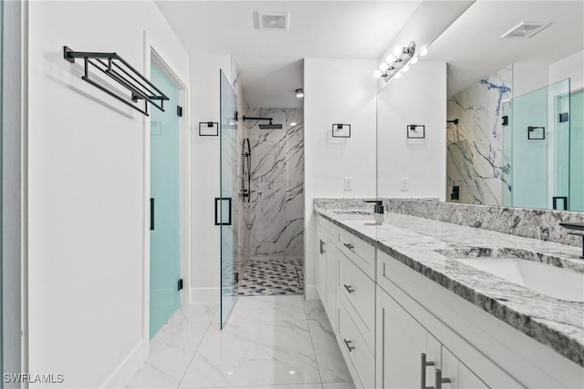 3613 39th St SW, Lehigh Acres, FL 33976 - bathroom featuring marble finish flooring, double vanity, a marble finish shower, and baseboards