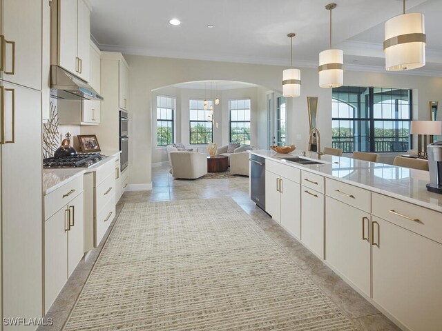 4701 Via Del Corso Ln Unit 401, Bonita Springs, FL 34134 - kitchen with open floor plan, ornamental molding, under cabinet range hood, plenty of natural light, and recessed lighting