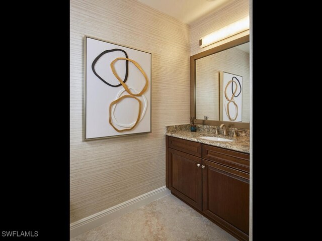 4701 Via Del Corso Ln Unit 401, Bonita Springs, FL 34134 - bathroom featuring wallpapered walls, tile patterned flooring, and vanity