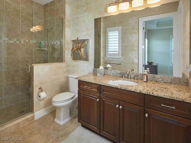 4701 Via Del Corso Ln Unit 401, Bonita Springs, FL 34134 - bathroom with vanity, a stall shower, and tile patterned flooring