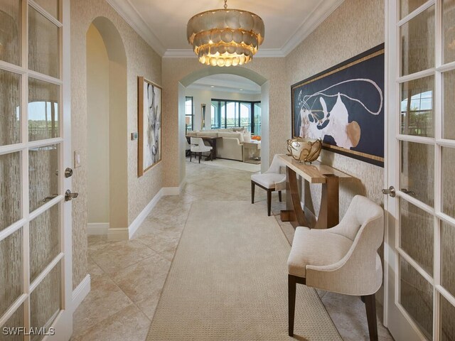 4701 Via Del Corso Ln Unit 401, Bonita Springs, FL 34134 - entryway featuring arched walkways, ornamental molding, french doors, a chandelier, and tile patterned flooring