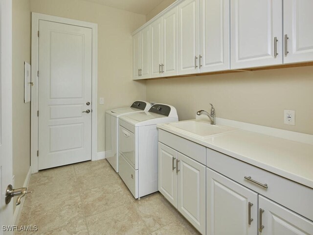 4701 Via Del Corso Ln Unit 401, Bonita Springs, FL 34134 - washroom with cabinet space, washing machine and clothes dryer, and light tile patterned floors